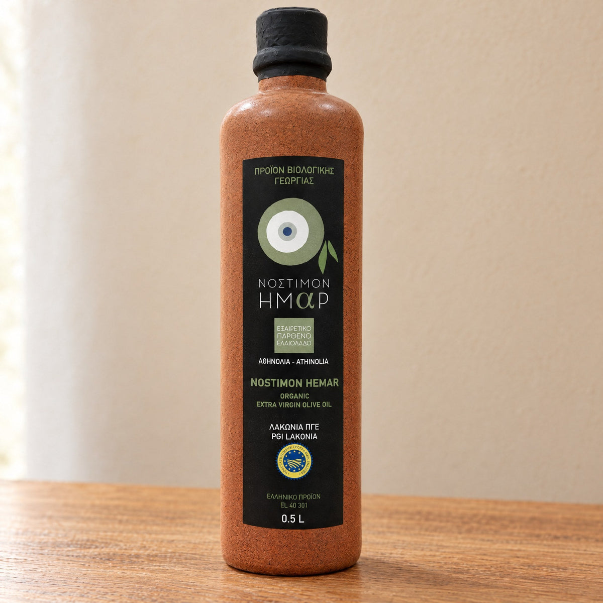Front label of the Nostimon Hemar ceramic bottle: single-variety Athinolia, organic, PGI Lakonia