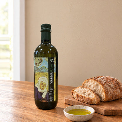 Harma Value extra virgin olive oil 1L bottle with a label showing a painting by Theofilos, beside bread