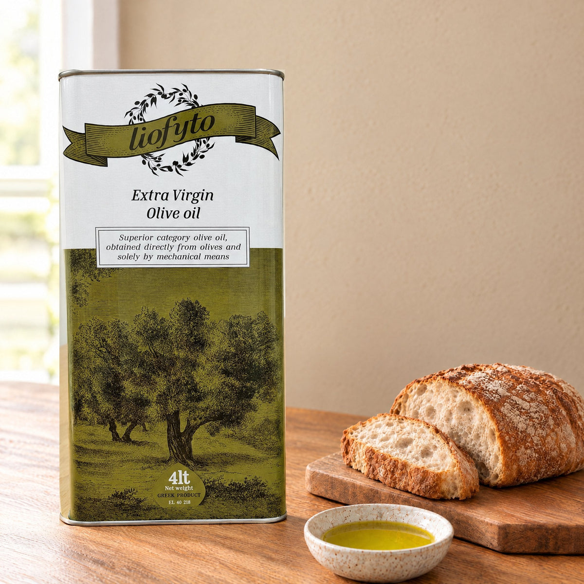 Liofyto extra virgin olive oil 4L tin on a kitchen table with bread and a dish of olive oil
